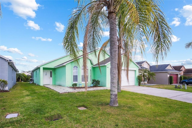 202 Aylesbury Ln, Davenport, FL 33837 - view of front of home featuring an attached garage, stucco siding, concrete driveway, and a front lawn
