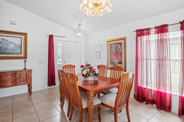 202 Aylesbury Ln, Davenport, FL 33837 - dining room with light tile patterned flooring, baseboards, an inviting chandelier, and lofted ceiling