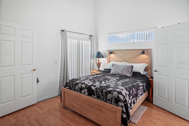 202 Aylesbury Ln, Davenport, FL 33837 - bedroom featuring a high ceiling and wood finished floors