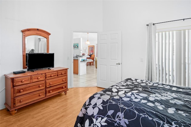 202 Aylesbury Ln, Davenport, FL 33837 - bedroom with a high ceiling and light wood-style flooring