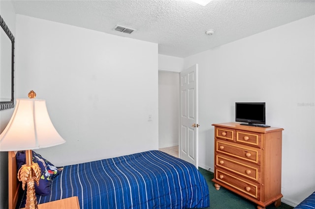 202 Aylesbury Ln, Davenport, FL 33837 - bedroom with visible vents, carpet flooring, and a textured ceiling
