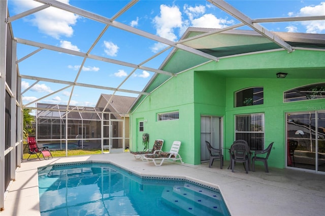202 Aylesbury Ln, Davenport, FL 33837 - outdoor pool with a patio area and a lanai