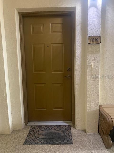 11446 Jasper Kay Ter Unit 202, Windermere, FL 34786 - doorway to property featuring stucco siding