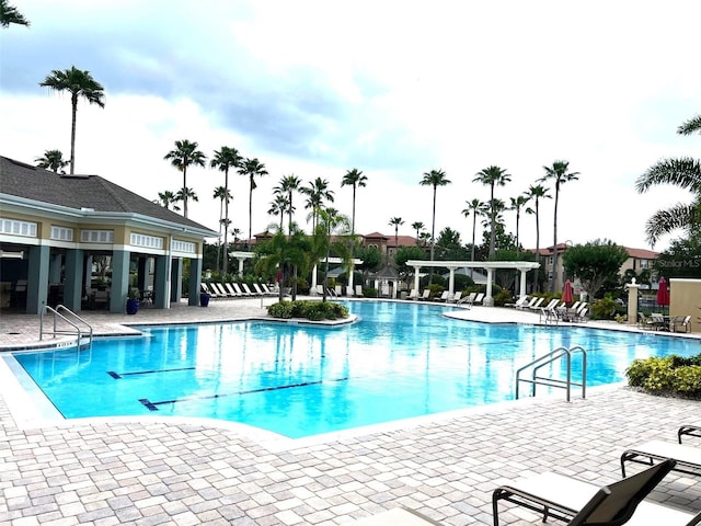 11446 Jasper Kay Ter Unit 202, Windermere, FL 34786 - community pool featuring a pergola and a patio area