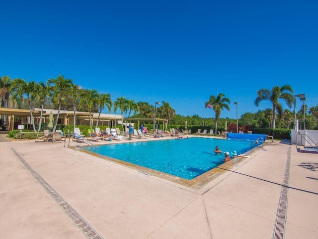 community pool with a patio area