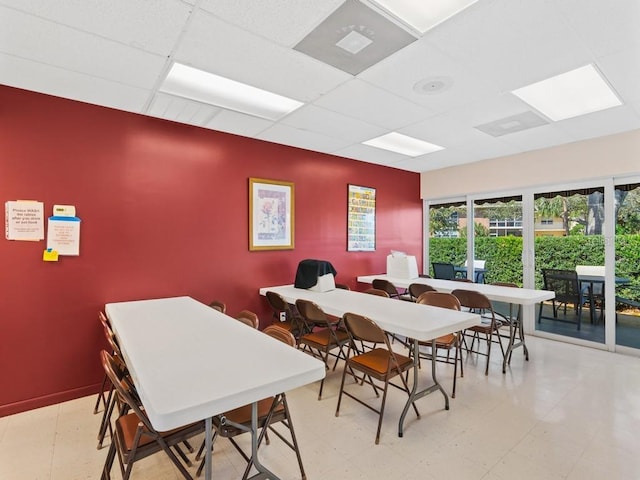 dining space featuring a paneled ceiling