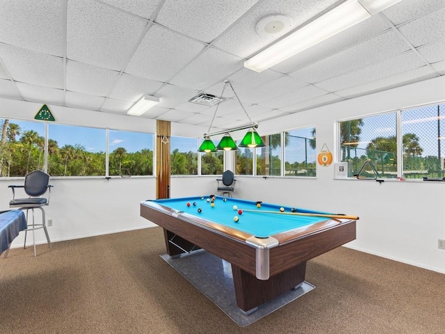 rec room with a paneled ceiling, carpet, healthy amount of natural light, pool table, and baseboards