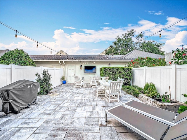 2240 Osprey Ave, Orlando, FL 32814 - fenced backyard with a patio area, area for grilling, and outdoor dining space