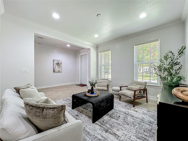 2240 Osprey Ave, Orlando, FL 32814 - living room with light tile patterned flooring, recessed lighting, crown molding, and plenty of natural light