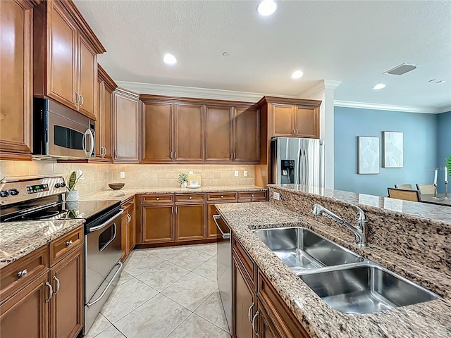 2240 Osprey Ave, Orlando, FL 32814 - kitchen with appliances with stainless steel finishes, ornamental molding, backsplash, light stone countertops, and light tile patterned floors