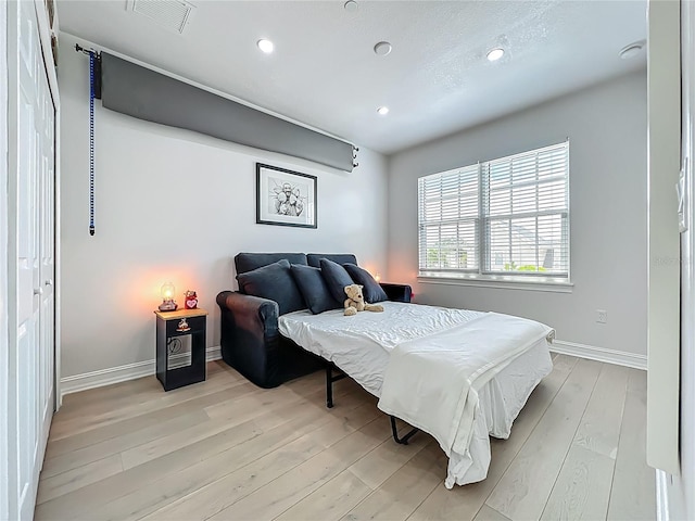 2240 Osprey Ave, Orlando, FL 32814 - bedroom with light wood finished floors and recessed lighting