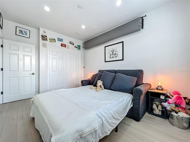 2240 Osprey Ave, Orlando, FL 32814 - bedroom with a closet, light wood-style flooring, and recessed lighting