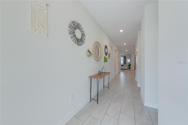 2760 Bookmark Dr, Kissimmee, FL 34746 - corridor featuring baseboards, recessed lighting, and light tile patterned floors