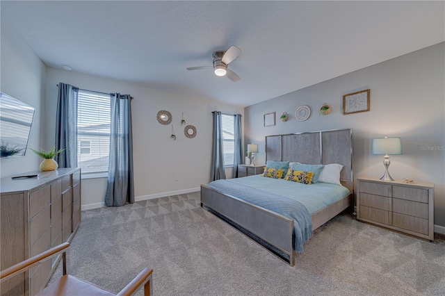 2760 Bookmark Dr, Kissimmee, FL 34746 - bedroom with baseboards, ceiling fan, and light colored carpet