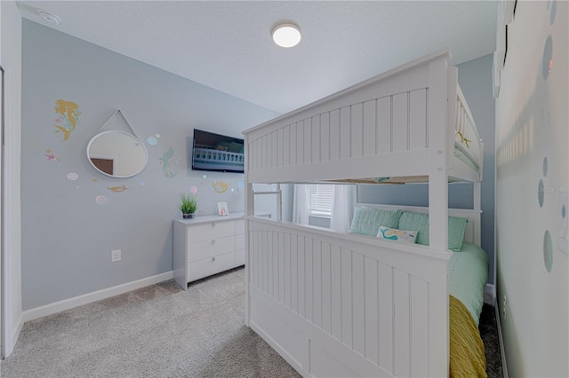 2760 Bookmark Dr, Kissimmee, FL 34746 - bedroom with light carpet, baseboards, vaulted ceiling, and a textured ceiling