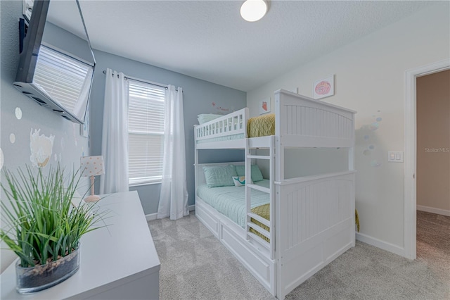 2760 Bookmark Dr, Kissimmee, FL 34746 - carpeted bedroom with baseboards and a textured ceiling