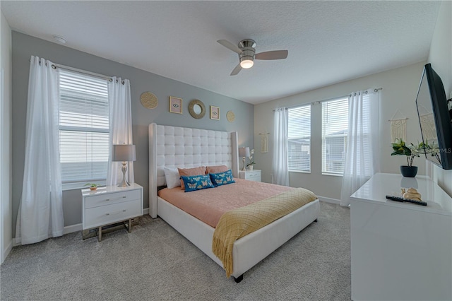 2760 Bookmark Dr, Kissimmee, FL 34746 - bedroom featuring a ceiling fan, light carpet, baseboards, and a textured ceiling