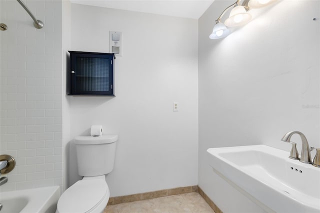full bath with baseboards, toilet, shower / washtub combination, a sink, and tile patterned flooring