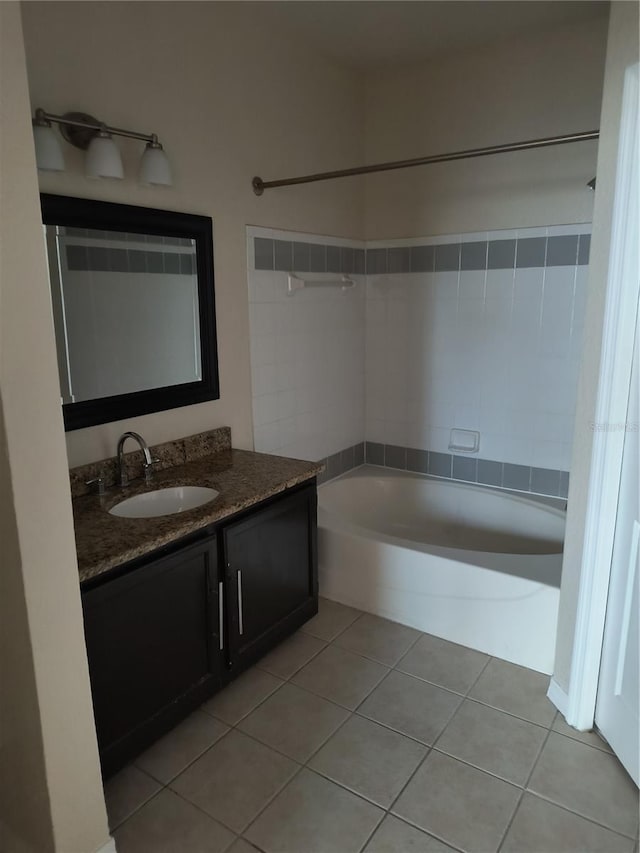 full bathroom with bathtub / shower combination, tile patterned floors, and vanity