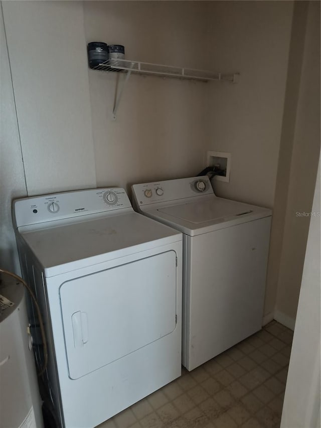 laundry area featuring washer and clothes dryer and laundry area