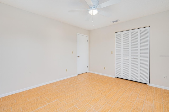 unfurnished bedroom with visible vents, baseboards, a closet, and ceiling fan