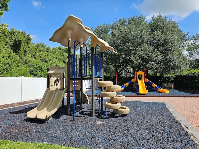 community jungle gym featuring fence