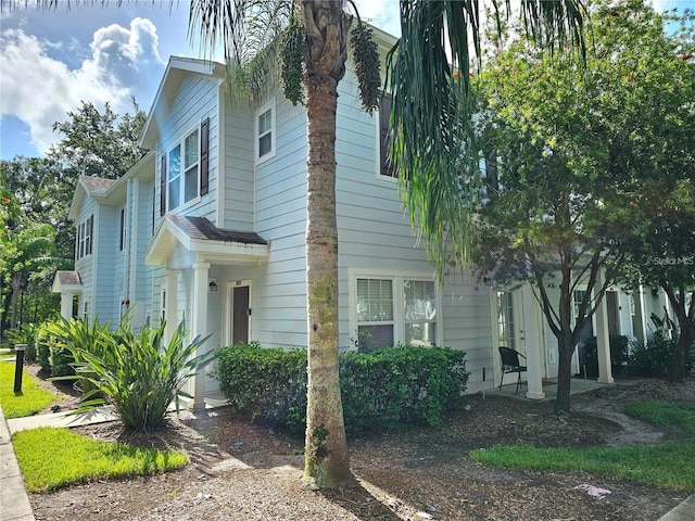 view of home's exterior featuring roof with shingles