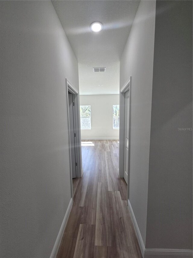 2644 SW 162 Nd Street Rd, Ocala, FL 34473 - corridor featuring wood finished floors, baseboards, and visible vents