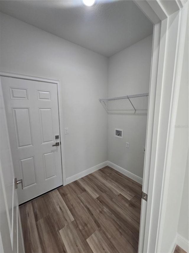 2644 SW 162 Nd Street Rd, Ocala, FL 34473 - laundry room featuring laundry area, wood finished floors, baseboards, and hookup for a washing machine