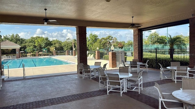 239 Longhirst Loop, Ocoee, FL 34761 - view of patio / terrace featuring a ceiling fan, a community pool, and outdoor dining space