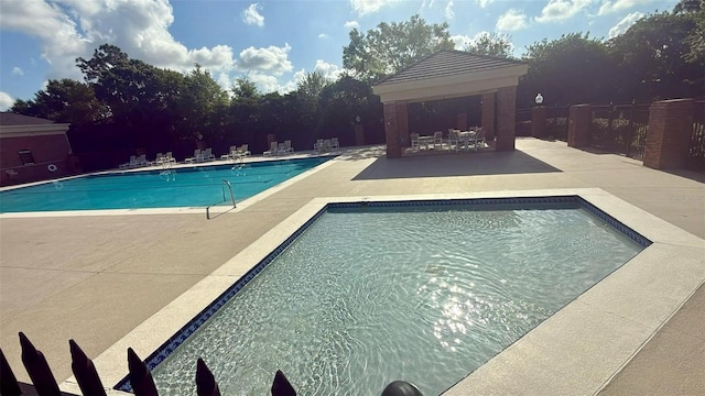 239 Longhirst Loop, Ocoee, FL 34761 - community pool featuring a gazebo and a patio