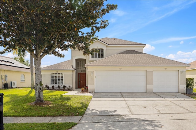 239 Longhirst Loop, Ocoee, FL 34761 - view of front facade featuring a garage, concrete driveway, stucco siding, a front yard, and roof with shingles
