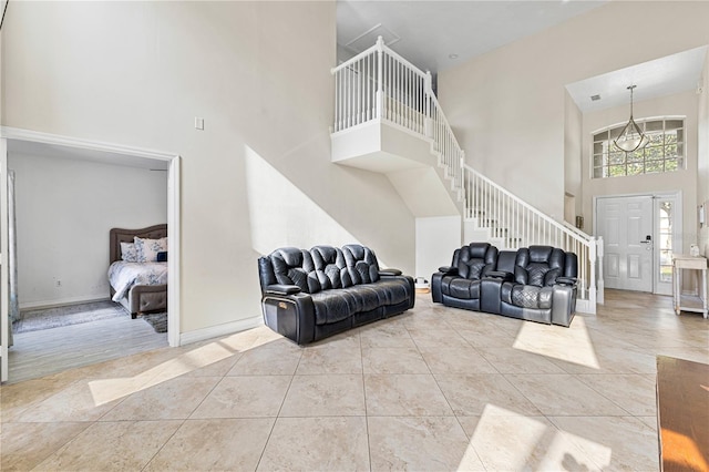 239 Longhirst Loop, Ocoee, FL 34761 - tiled living area featuring a towering ceiling and stairs