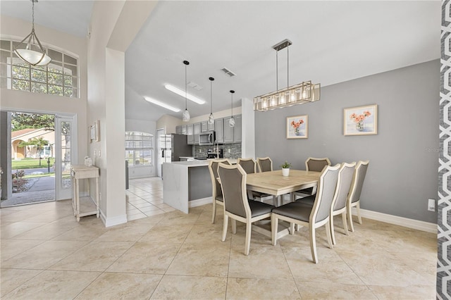 239 Longhirst Loop, Ocoee, FL 34761 - dining space with light tile patterned floors and vaulted ceiling