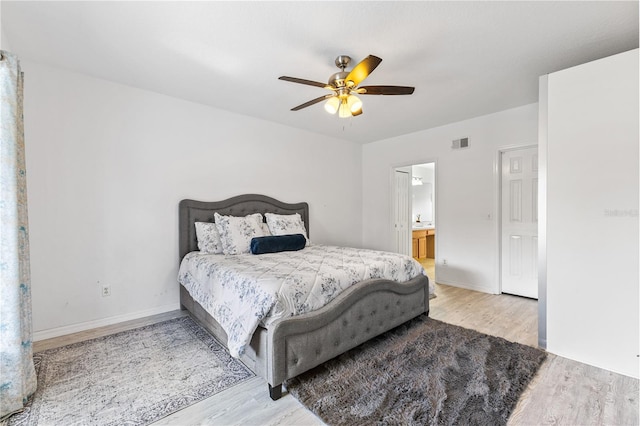 239 Longhirst Loop, Ocoee, FL 34761 - bedroom featuring wood finished floors, ceiling fan, and ensuite bathroom