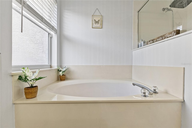 239 Longhirst Loop, Ocoee, FL 34761 - bathroom featuring a garden tub and tiled shower