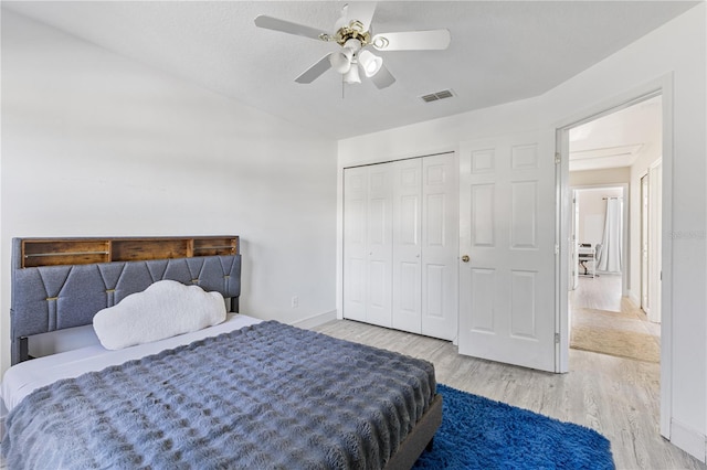 239 Longhirst Loop, Ocoee, FL 34761 - bedroom with wood finished floors, a closet, vaulted ceiling, and a ceiling fan