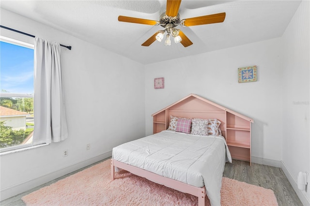 239 Longhirst Loop, Ocoee, FL 34761 - bedroom with wood finished floors and a ceiling fan