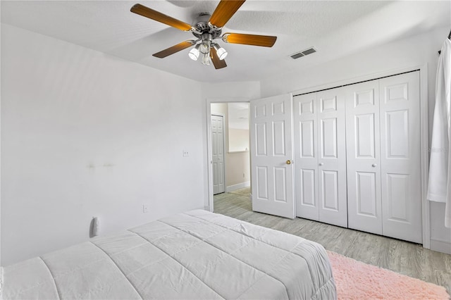239 Longhirst Loop, Ocoee, FL 34761 - bedroom featuring light wood-style floors, a closet, and ceiling fan