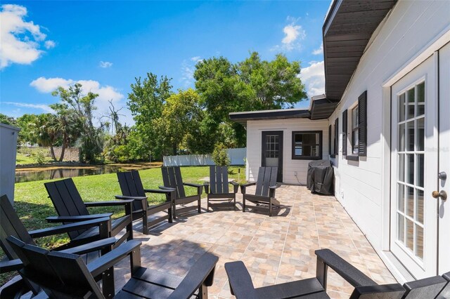 3204 Tradewinds Trl, Orlando, FL 32805 - view of patio / terrace featuring a water view and a grill