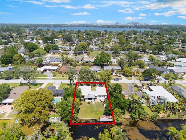 3204 Tradewinds Trl, Orlando, FL 32805 - aerial perspective of suburban area featuring a nearby body of water and property boundaries highlighted