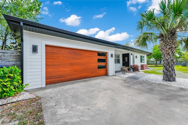 exterior space with driveway and an attached garage