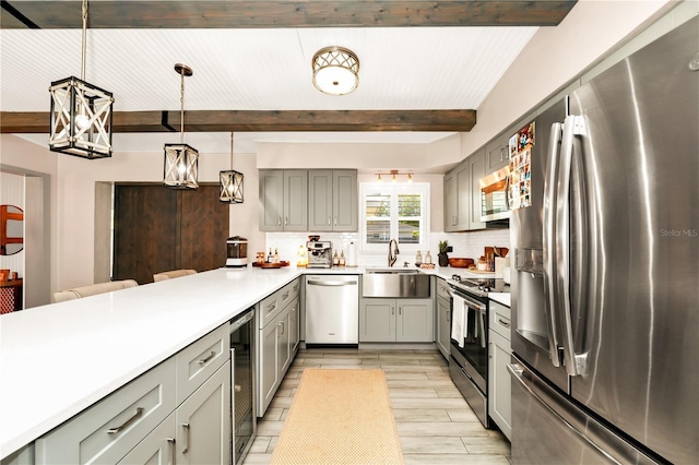 kitchen with gray cabinets, stainless steel appliances, wine cooler, and beamed ceiling