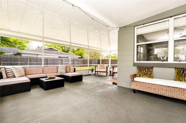 view of patio / terrace with an outdoor living space and a fenced backyard