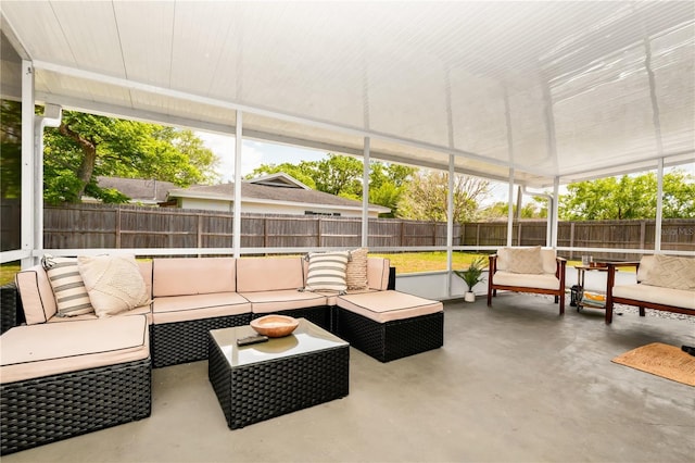 sunroom featuring an outdoor living space