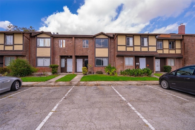 5060 Downing St Unit 6, Orlando, FL 32839 - view of property featuring uncovered parking