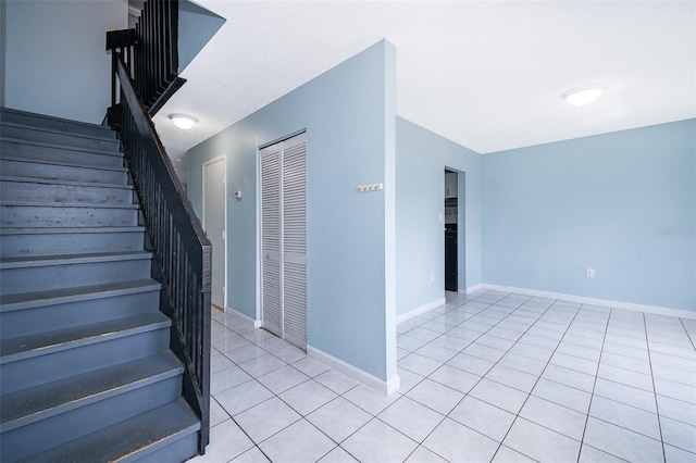 5060 Downing St Unit 6, Orlando, FL 32839 - stairway with tile patterned flooring and baseboards