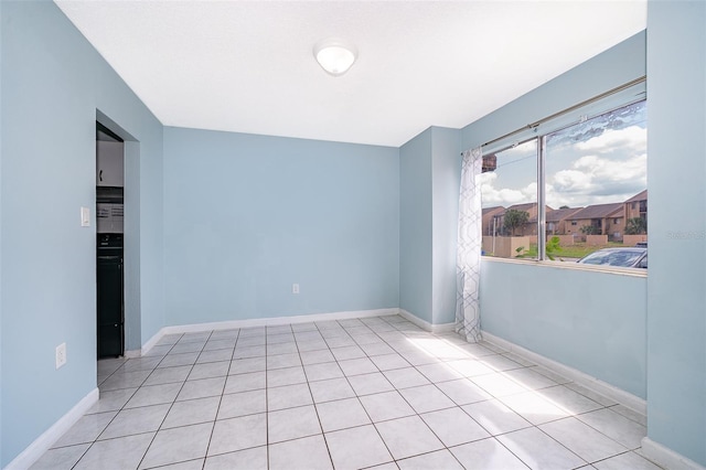 5060 Downing St Unit 6, Orlando, FL 32839 - unfurnished room with baseboards and tile patterned flooring
