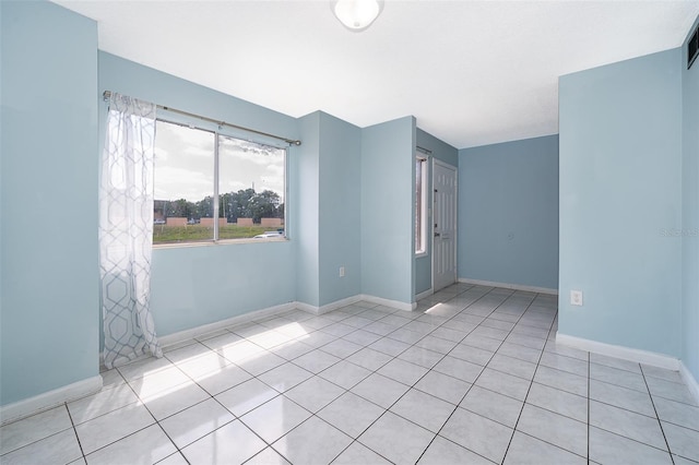 5060 Downing St Unit 6, Orlando, FL 32839 - unfurnished room featuring tile patterned flooring and baseboards