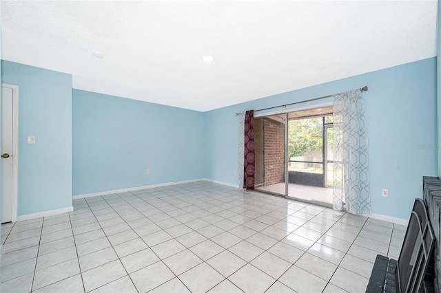 5060 Downing St Unit 6, Orlando, FL 32839 - empty room featuring baseboards and light tile patterned flooring